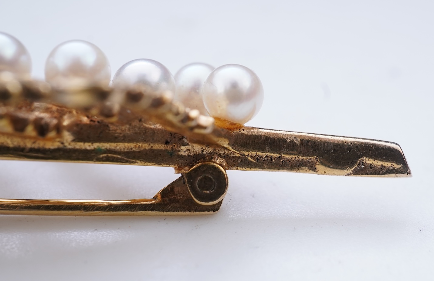 Two cultured pearl brooches